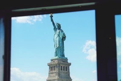 View of statue of liberty through window
