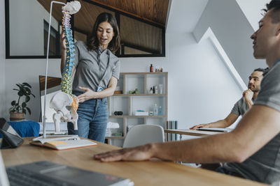 Woman working on table at home