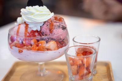 Close-up of ice cream in glass on table