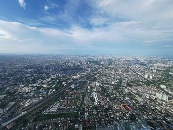 High angle view of city against cloudy sky