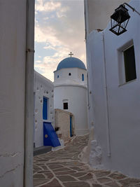 Church amidst buildings against sky