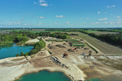 High angle view of land and sea against sky