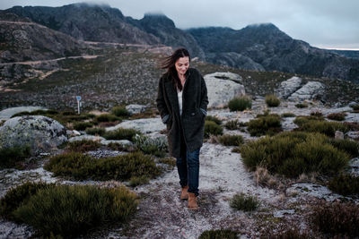 Woman standing on mountain