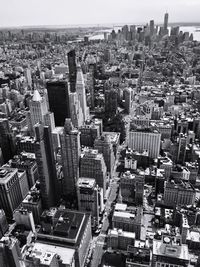 High angle view of modern buildings in city against sky