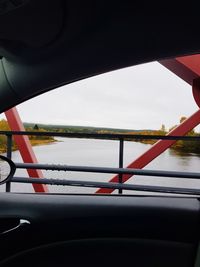 Scenic view of river seen through car windshield