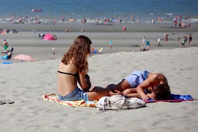 Rear view of women on beach