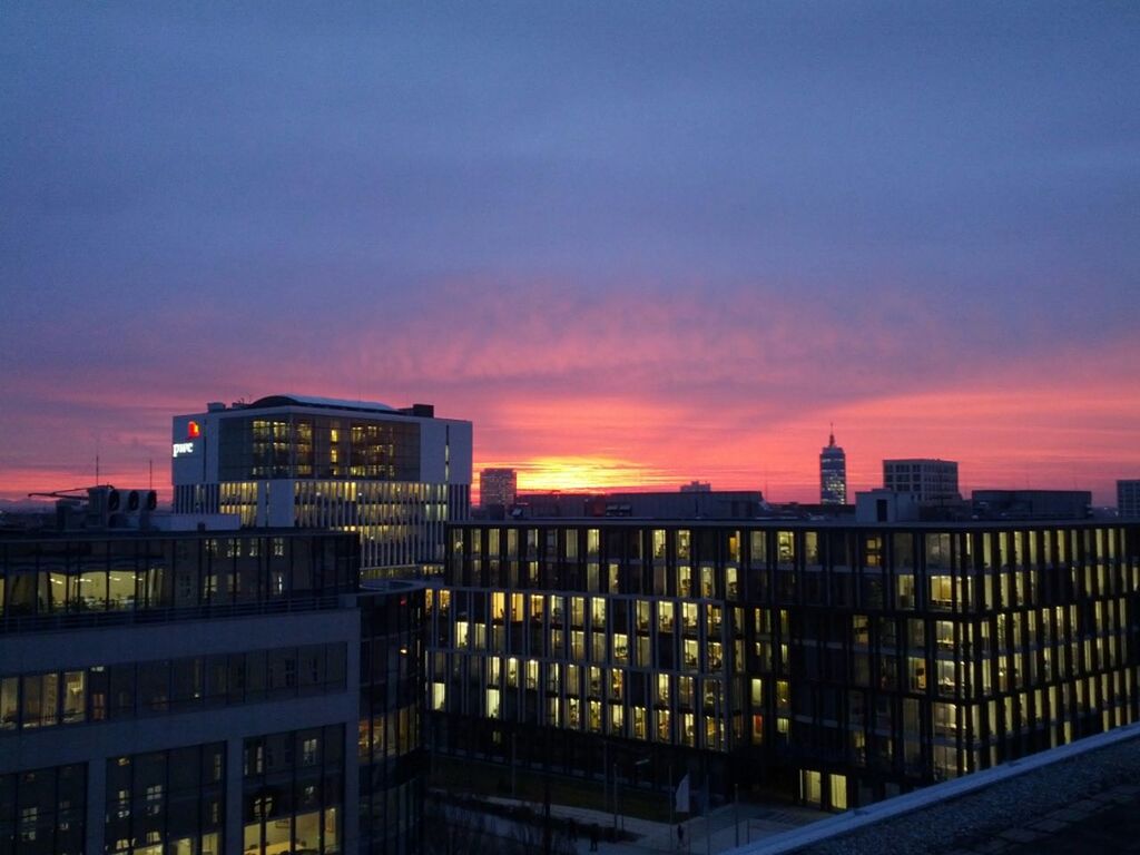 architecture, sunset, building exterior, built structure, orange color, city, sky, residential building, building, residential structure, cloud - sky, dusk, illuminated, railing, outdoors, no people, silhouette, cityscape, city life, residential district