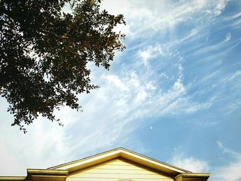 High section of built structure against cloudy sky