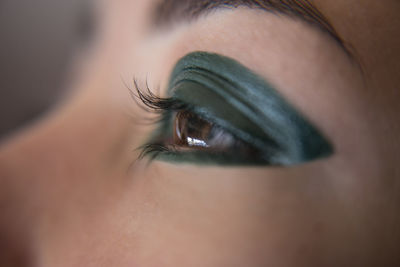 Close-up of cropped woman with eye make-up