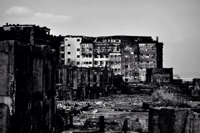 Damaged buildings against sky