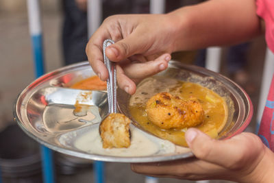 Midsection of man holding food