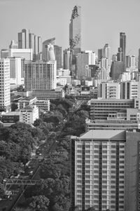 Buildings in city against clear sky