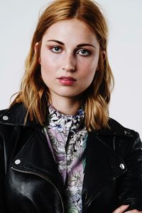 Portrait of beautiful young woman over white background