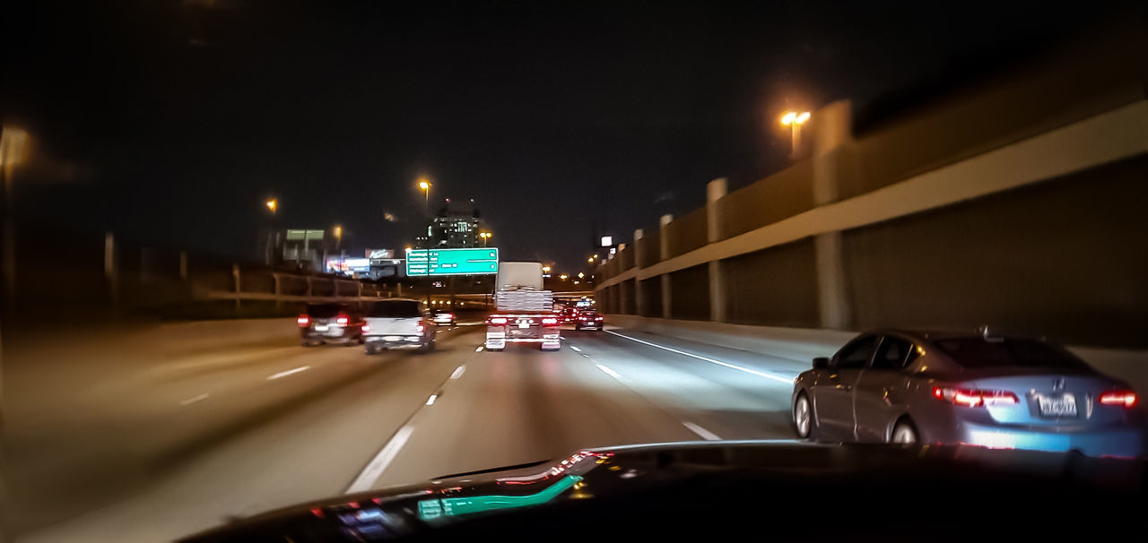 VEHICLES ON ROAD IN CITY