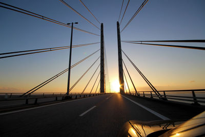 View of suspension bridge against sky during sunset