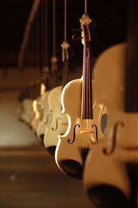 Violins in row at shop