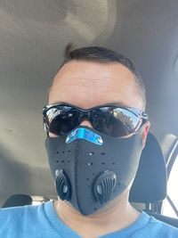 Close-up portrait of man wearing mask