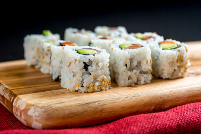 Close-up of sushi on cutting board