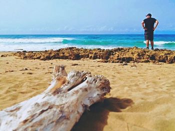 Full length of man standing on beach