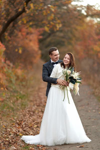 Portrait of bride holding bouquet