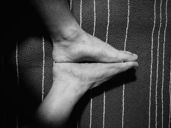 Directly above shot of man sitting on bed