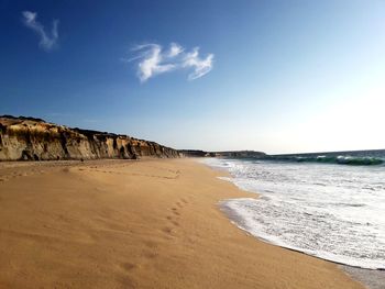 Scenic view of beach against sky