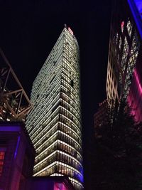 Low angle view of modern building at night