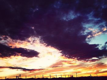Low angle view of cloudy sky at sunset
