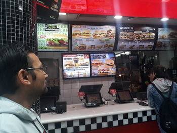 Portrait of woman looking at store