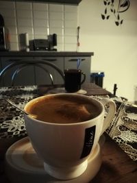 Close-up of coffee cup on table