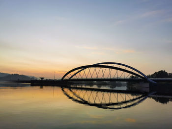 View of bridge over lake against sky during sunset