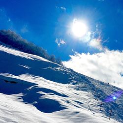 Scenic view of snow covered mountains against clear sky