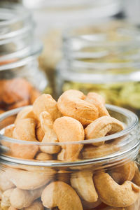 Close-up of nuts in jar on table