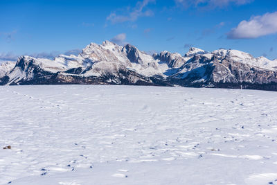 Views and huts in the snow. alpe di siusi. italy