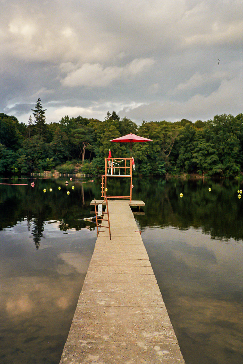 SCENIC VIEW OF PIER ON LAKE AGAINST SKY