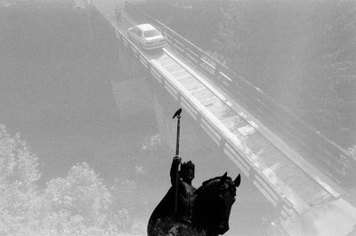 Low angle view of horse statue against sky