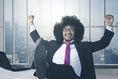 Afro businessman wearing suit working in office