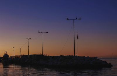 Scenic view of sea against clear sky during sunset