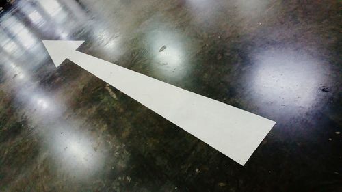 High angle view of arrow sign on airplane