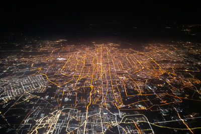 Aerial view of illuminated cityscape at night