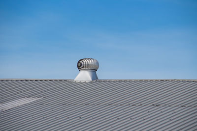 Low angle view of building against clear blue sky