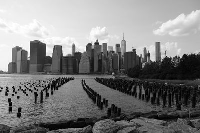 View of cityscape against cloudy sky