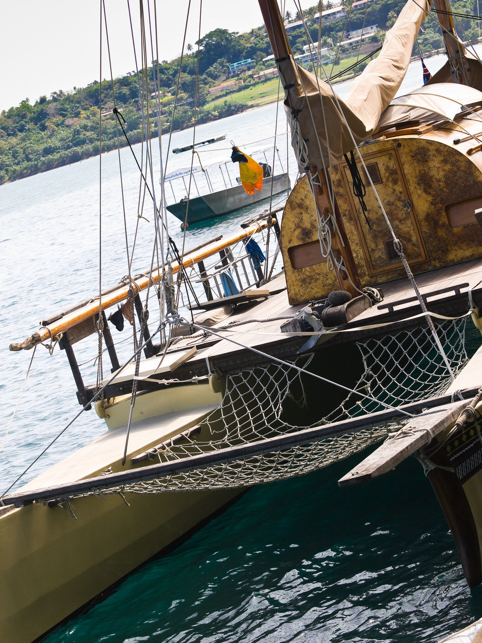 BOATS MOORED ON CALM LAKE