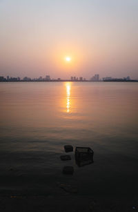 Scenic view of sea against sky during sunset