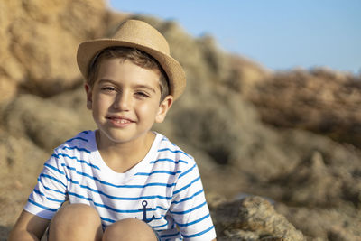 Portrait of smiling boy in rock