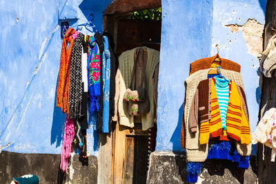 Low angle view of clothes hanging at market