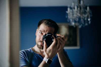 Portrait of man photographing