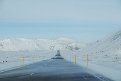 Scenic view of snow covered mountain against sky