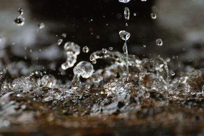 Close-up of water splashing against blurred background