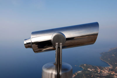 Close-up of coin-operated binoculars against clear sky